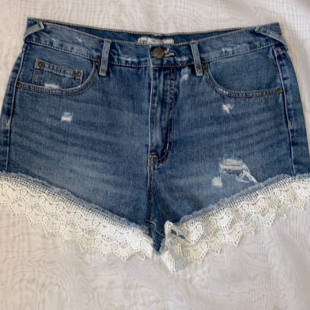 FREE PEOPLE Distressed Denim Shorts with Lace Accents